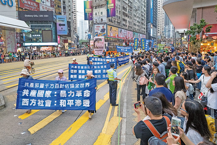 2019年4月27日，香港法輪功學員舉行紀念「四．二五」20周年暨聲援3億3千萬人退出中共集會和大遊行。（李逸／大紀元）