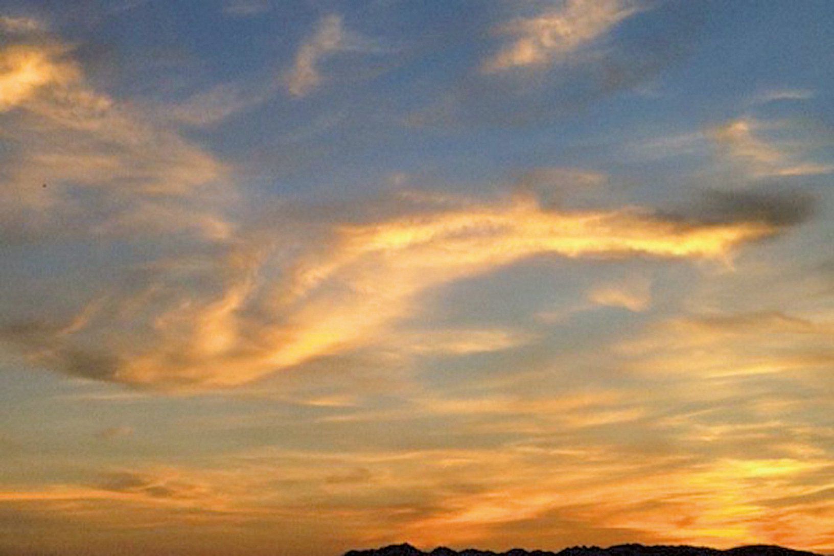 美國西雅圖上空的流雲與夕陽（攝影：貫明）