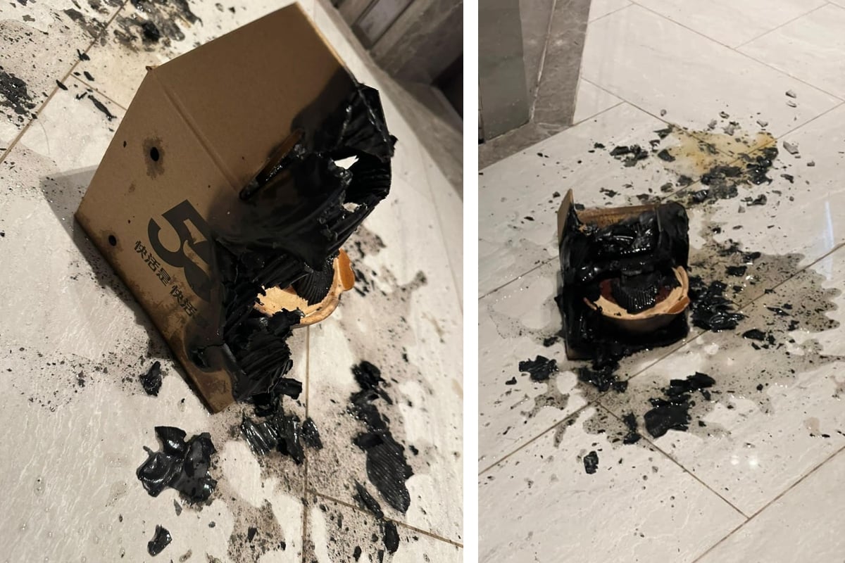 事發後煲仔飯的紙皮盒被燒剩一半，並有熏黑，露出盛載煲仔飯的瓦煲，地上亦遺留燒黑的痕跡。（Angel Ka Yan Chan fb圖片）