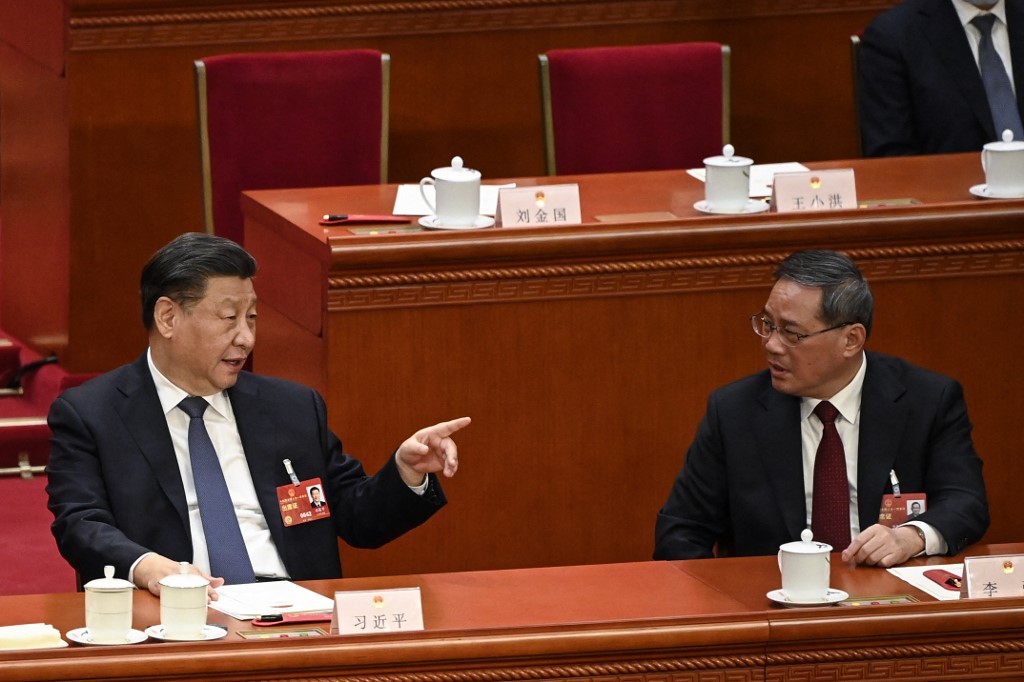 3月11日，習近平和李強（右）在中共全國人大會議上。（Greg Baker/POOL/AFP）