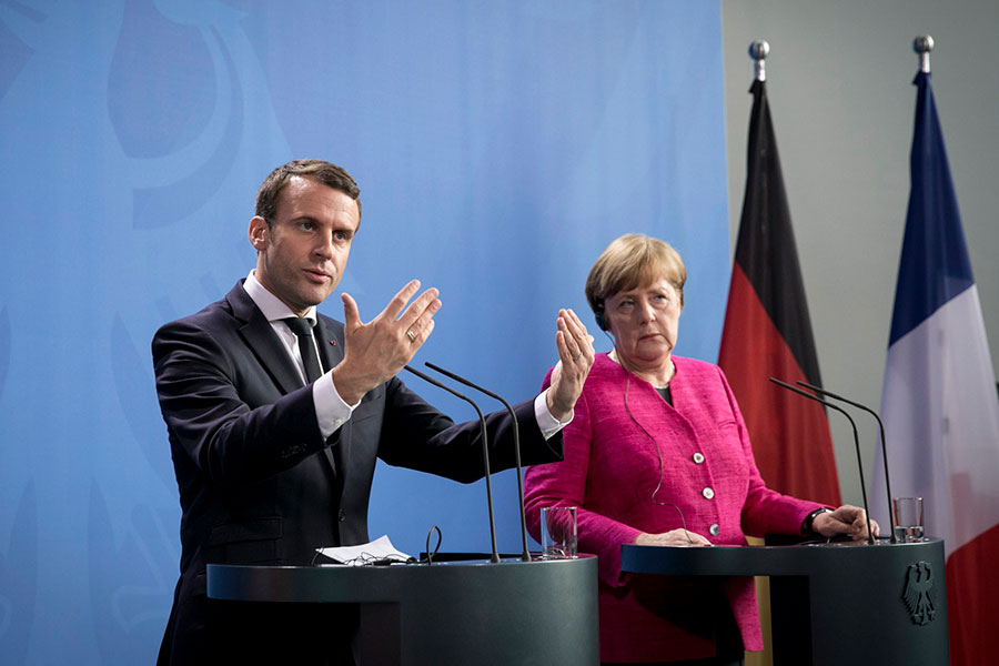默克爾和馬克龍舉行了聯合記者招待會。兩人均表示要強化歐洲和歐元區，在雙方都關心的議題上共同努力。（Axel Schmidt/Getty Images）