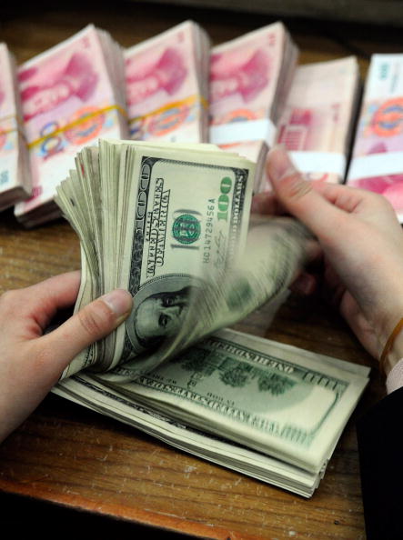 中共央行取消「兩金」人民幣升勢難續