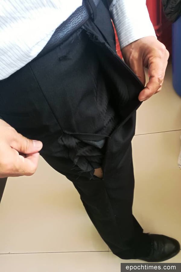 程海律師的褲子被撕破了10厘米。（李文足推特）
