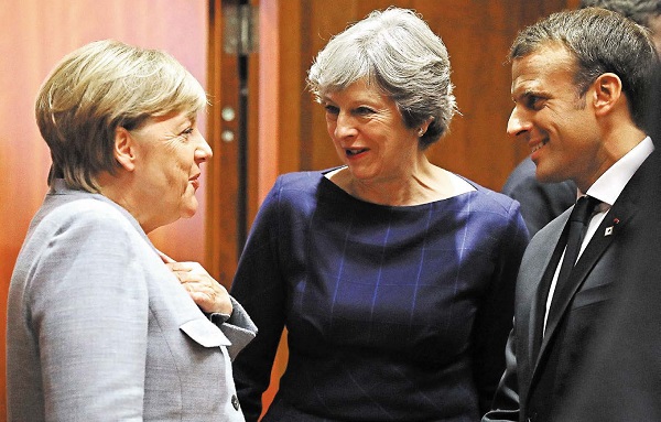 英國首相認為歐盟峰會期間，脫歐談判取得重要進展，德國總理默克爾希望12月開始貿易談判，法國總統馬克龍態度比較強硬，認為進展還不到一半。（istockphoto.com/AntonioGuillem）