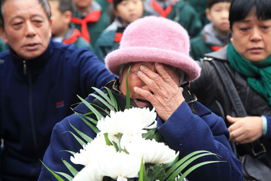 圖為南京大屠殺倖存者代表在公祭儀式上。（AFP/Getty Images）