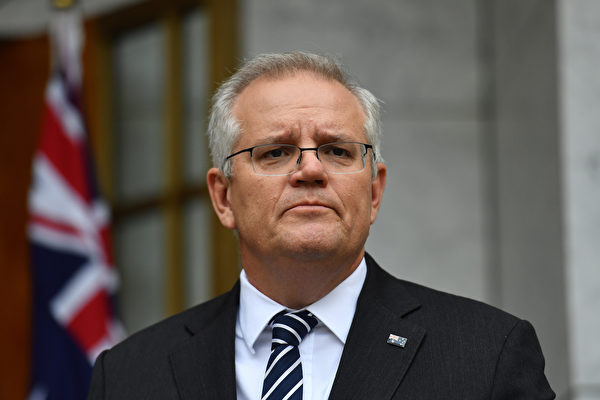 2021年11月22日，澳洲總理莫里森警告說，中共對貿易夥伴實施經濟脅迫，難以加入CPTTP。圖為2021年6月4日，莫里森在坎培拉議會大廈總理庭院舉行的新聞發布會上。（Sam Mooy/Getty Images）