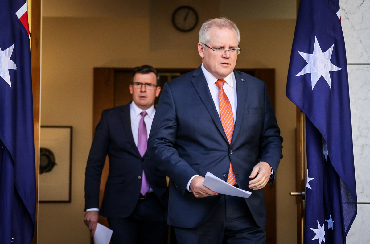 澳洲總理莫里森（右），於2020年7月9日正式宣佈暫停與香港簽訂的引渡協議。（David Gray/Getty Images）
