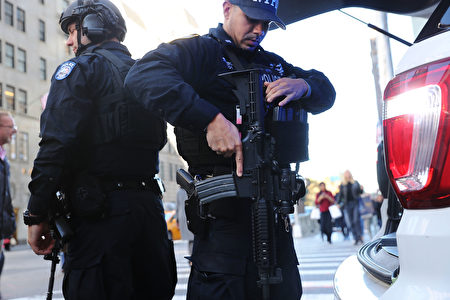 NEW YORK, NY - NOVEMBER 08: Counterterrorism police patrol near Trump Tower on Election Day on November 8, 2016 in New York City. Throughout the country, millions of Americans are casting their votes today for either Hillary Clinton or Donald Trump to become the 45th president of the United States. (Photo by Spencer Platt/Getty Images)
