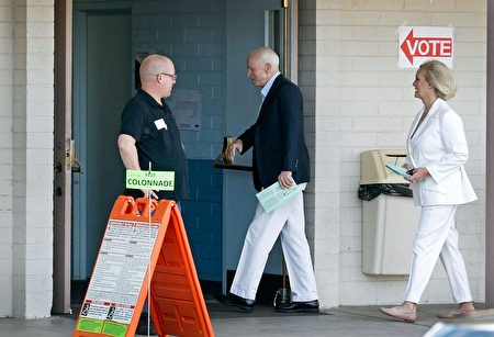 PHOENIX, AZ - NOVEMBER 08: Sen. John McCain (R-AZ), center, and his wife Cindy arrive at the Mountain View Christian Church polling place to cast their vote on November 8, 2016 in Phoenix, Arizona. Throughout the country, millions of Americans are casting their votes today for either Hillary Clinton or Donald Trump to become the 45th president of the United States. (Photo by Ralph Freso/Getty Images)