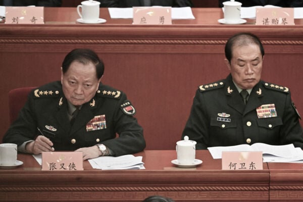 3月4日,張又俠(左)、何衛東(右)在中共政協會議開幕式上。(Pedro Pardo/AFP via Getty Images)
